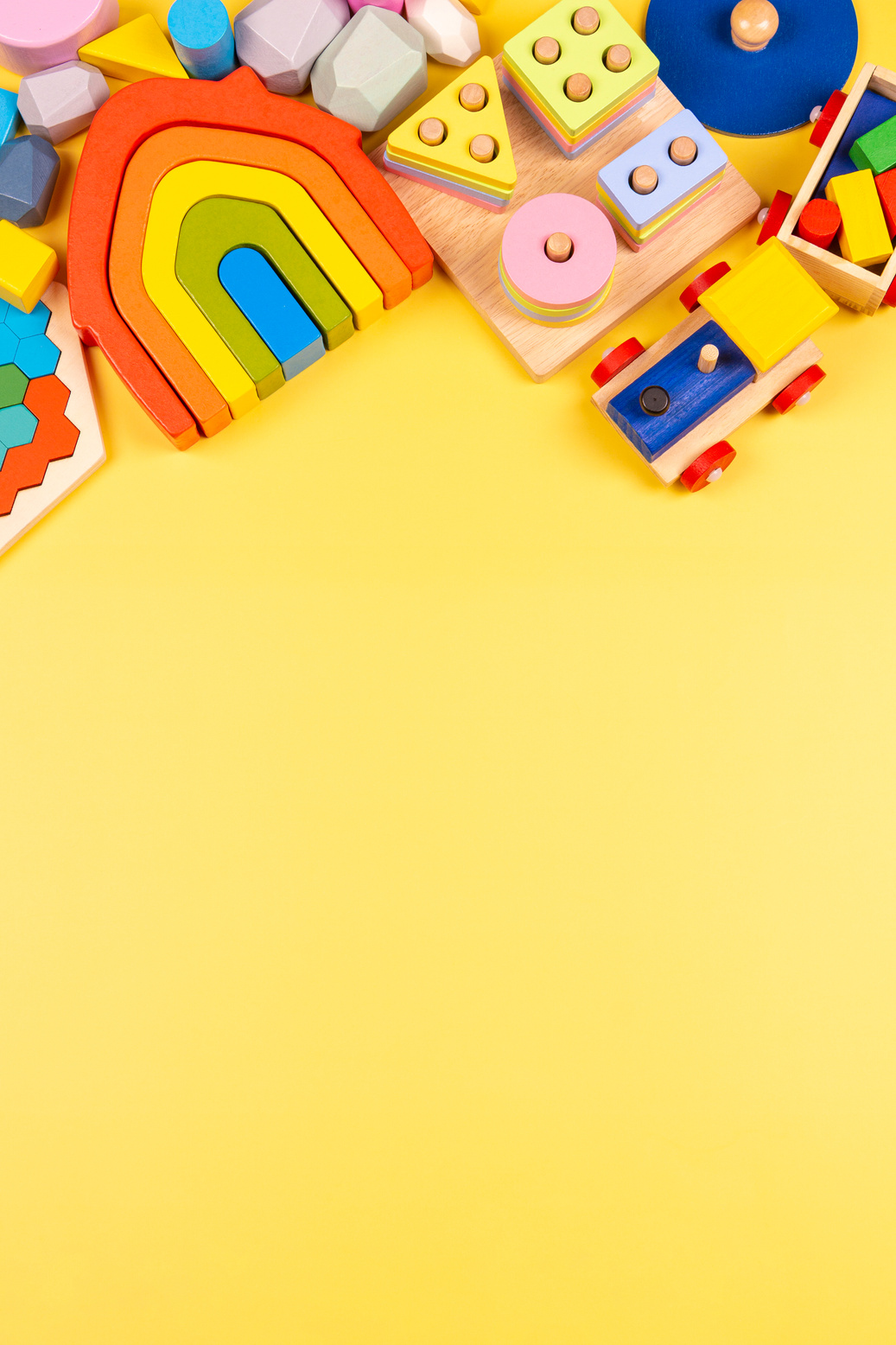 Children's Toys on Yellow Background